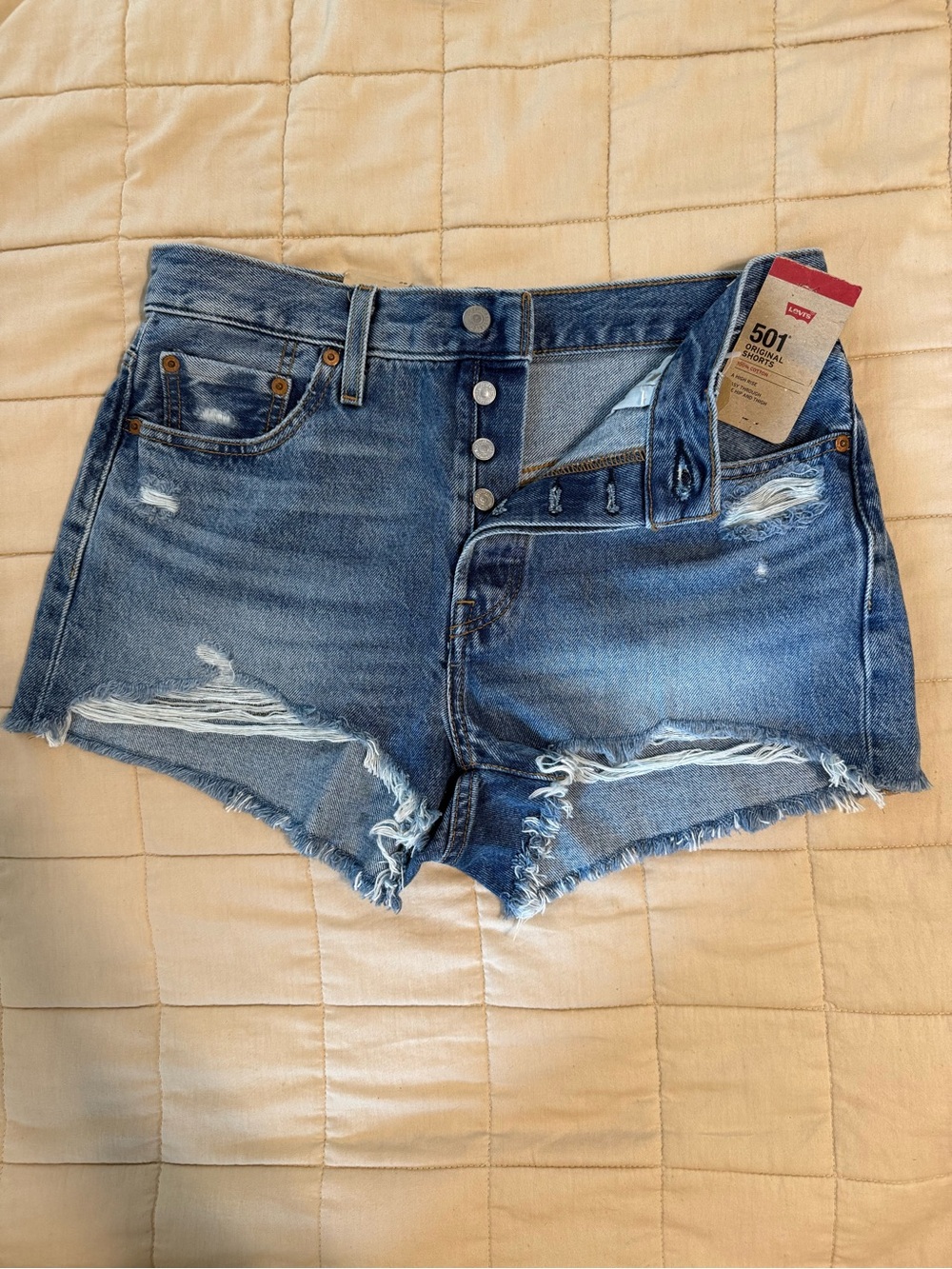 Levi's 501 Distressed Button-Fly Denim Shorts in Medium Blue